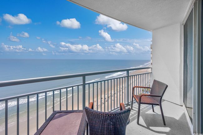 Balcony with a view of the beach and a water view | Image 19