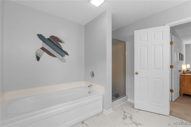 Full bath with a bath, marble finish floor, and a shower stall | Image 24