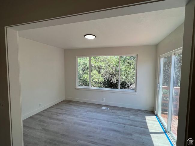 Spare room with wood finished floors | Image 9