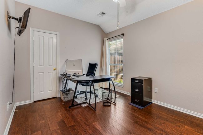 Office featuring a ceiling fan, hardwood floors, baseboards, and lofted ceiling | Image 28
