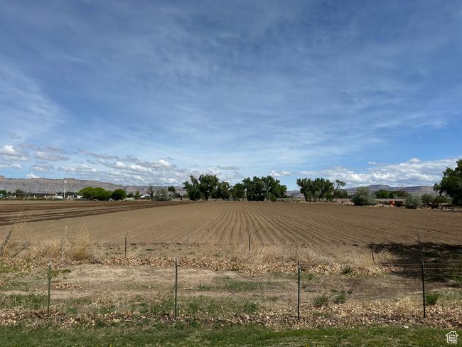 View of yard featuring a rural view and an enclosed riding area | Image 19