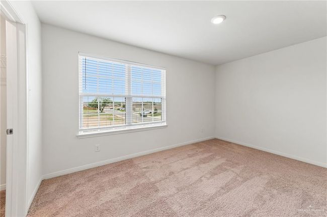 Carpeted empty room with baseboards | Image 26