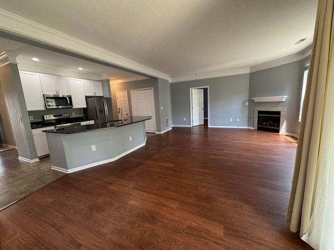 View past the dining area toward the kitchen and owner BR on the other end | Image 20