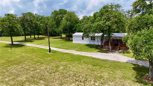 View of green lawn featuring a porch | Image 5