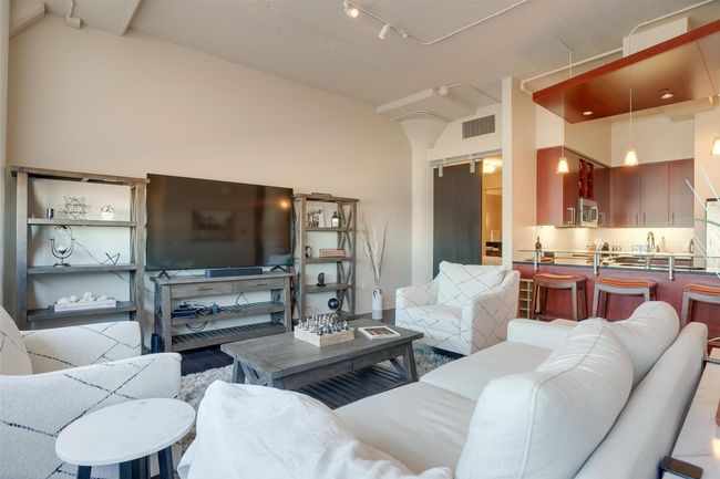Living area with vaulted ceiling and track lighting | Image 19