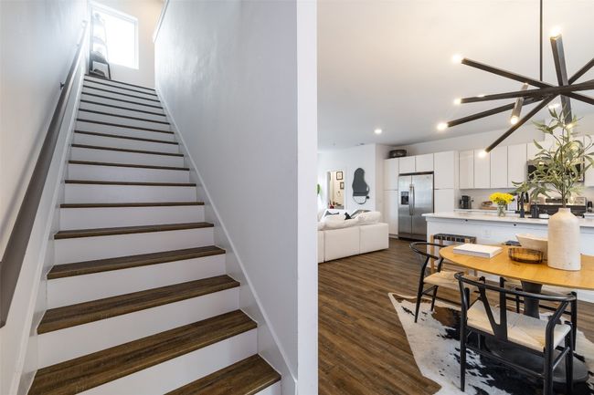 Staircase with recessed lighting and wood finished floors | Image 13
