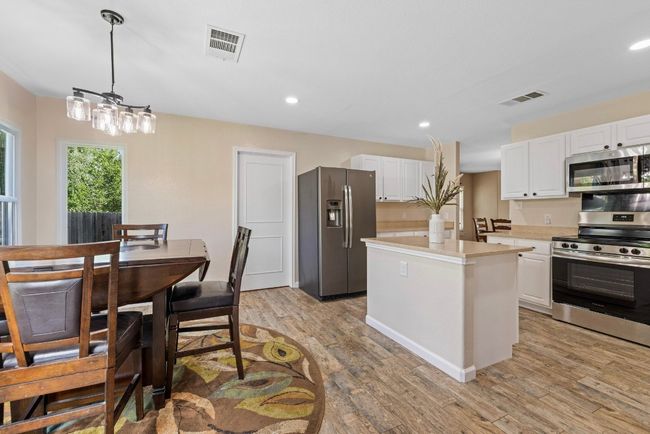 Open to both the family and breakfast rooms, the kitchen is perfectly positioned for both casual meals and large gatherings. | Image 13