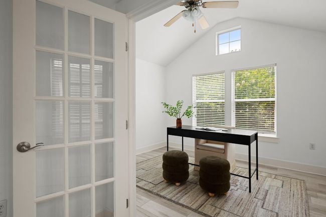 Office space featuring vaulted ceiling, wood finished floors, ceiling fan, and baseboards | Image 11