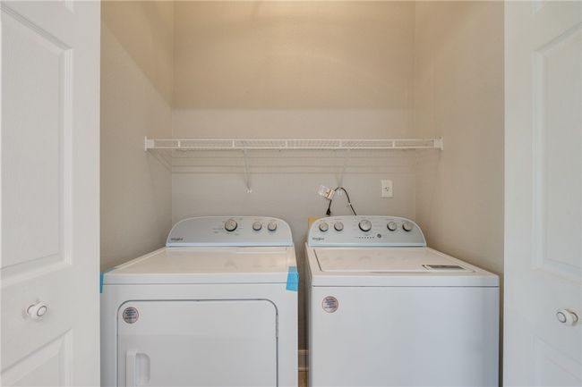 Laundry room with washing machine and clothes dryer | Image 6