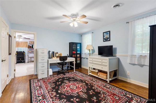 Office space featuring a ceiling fan and wood finished floors | Image 27