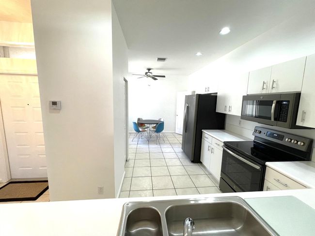 9675 Crescent View Dr N, Condo with 3 bedrooms, 2 bathrooms and null parking in Boynton Beach FL | Image 5