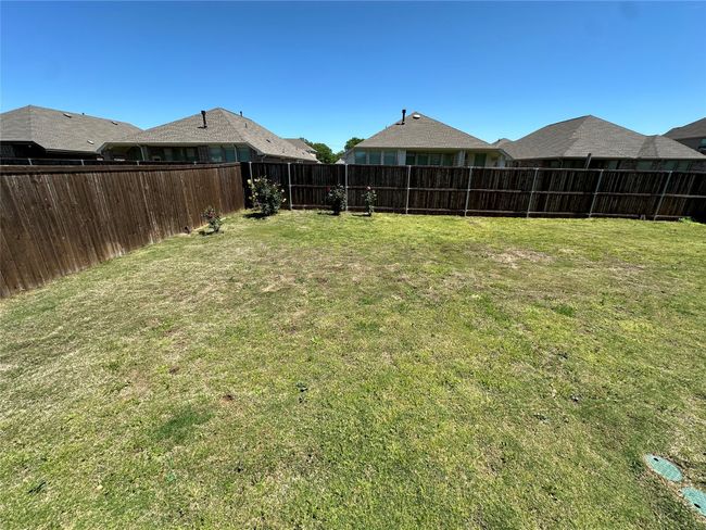 View of yard featuring a fenced backyard | Image 13