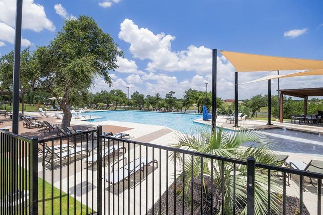 Community pool with a patio area | Image 35