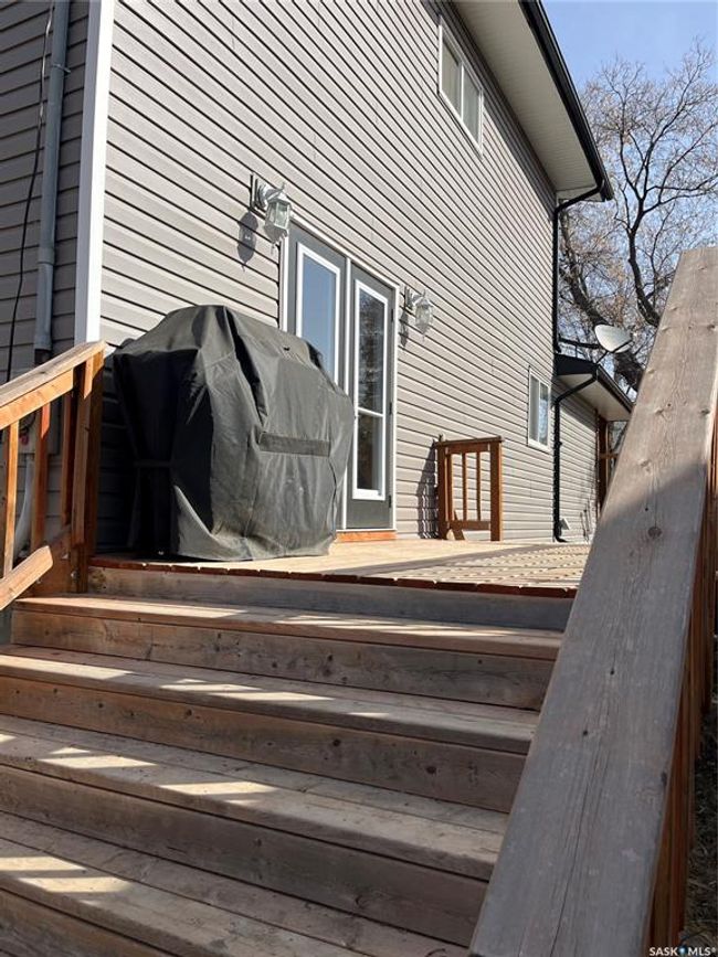Wooden terrace featuring a grill | Image 6