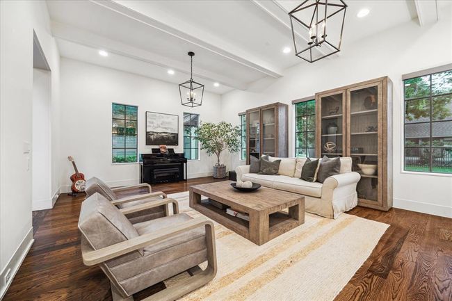 FORMAL LIVING. Note all the windows which are a predominant feature in the home. Motorized window shades by Hunter Douglas. | Image 4