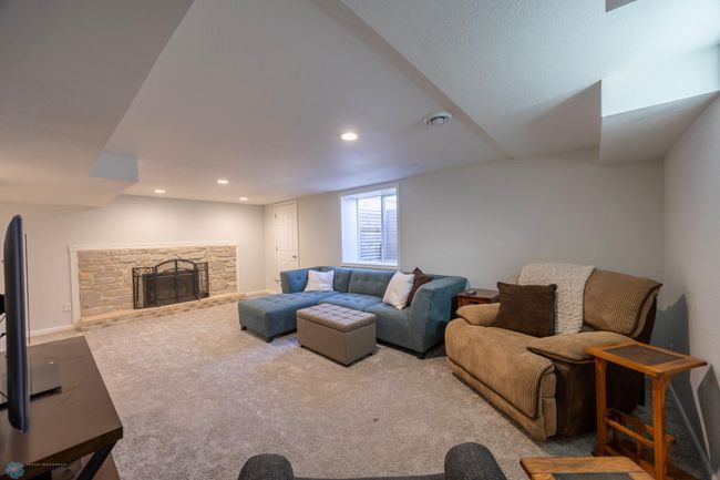 Beautiful Natural Light and Fireplace with plenty of space to relax, read or watch a movie! | Image 15