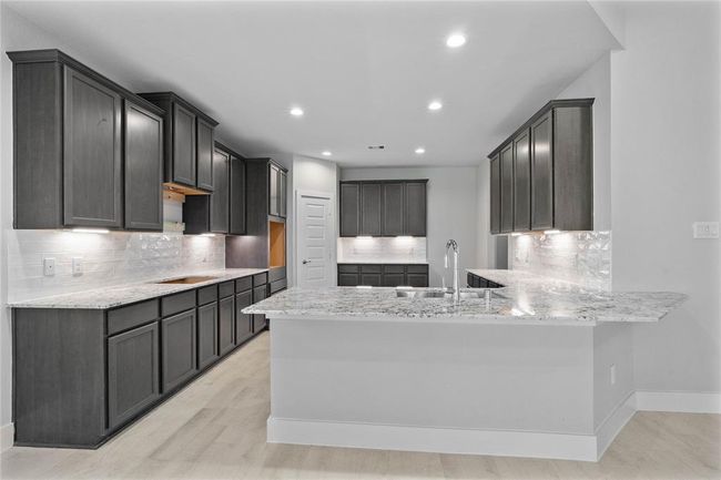 This photo is for illustrative purposes only and is not to be considered an exact replica of the finished home. Rendering does not match the finished product in terms of features, colors, landscaping, etc. Pricing, specifications, square footage and materials are subject to change at any time and without notice. | Image 4