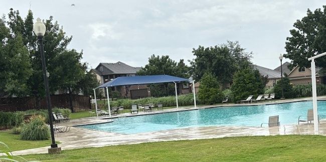 Community pool with a lawn, a gazebo, and a patio | Image 32