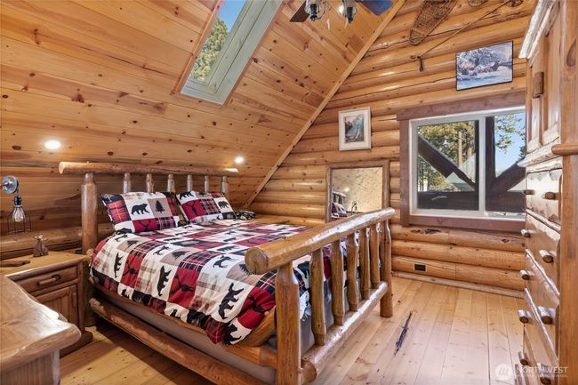 Primary bedroom located upstairs. Sky light and large window allowing the natural light to flood in. | Image 25