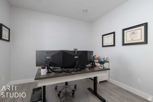 Office with wood finished floors and baseboards | Image 7