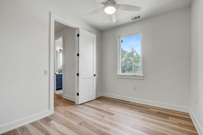 Unfurnished room with ceiling fan, light wood-style floors, and baseboards | Image 19