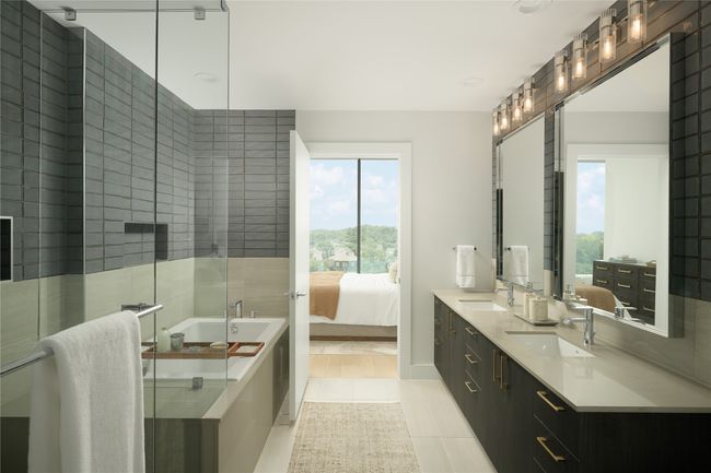 Ensuite bathroom with a tub to relax in, plenty of natural light, double vanity, and tile patterned floors | Image 10