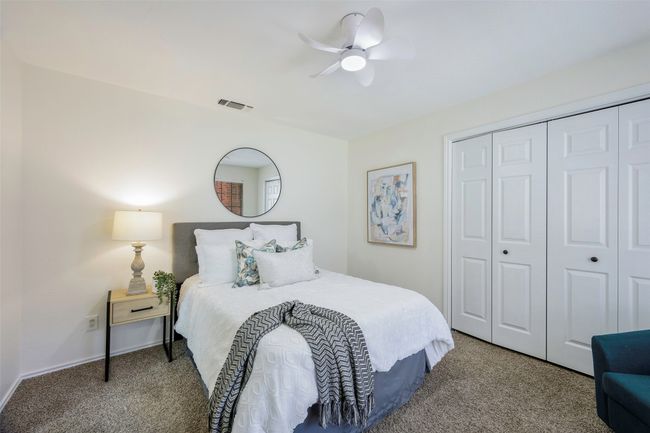 Bedroom featuring carpet, visible vents, a closet, and ceiling fan | Image 5
