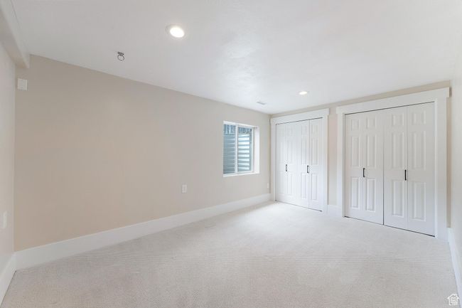 Bedroom 5 with multiple closets, carpet, and recessed lighting | Image 27