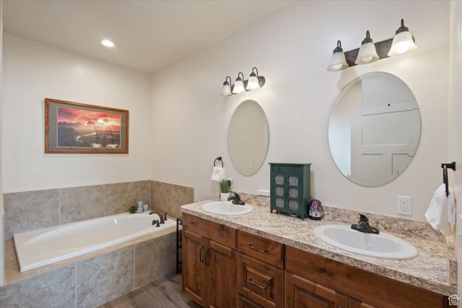 Full bath with a bath, double vanity, and a sink | Image 22