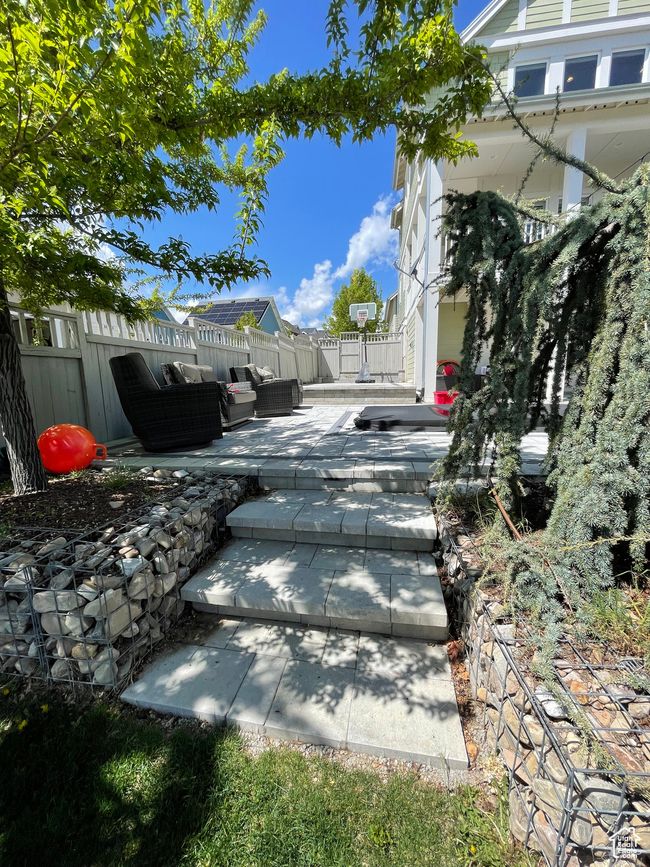View of yard featuring an outdoor hangout area, a patio, and fence | Image 65