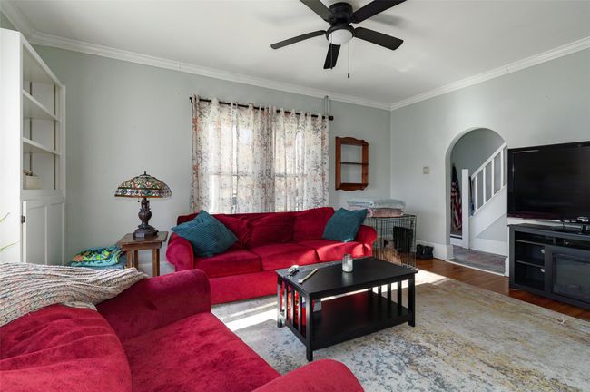 Living room with hardwood / wood-style floors, ceiling fan, and ornamental molding | Image 6