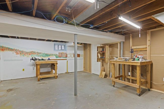 Basement area featuring a workshop area and additional storage | Image 21
