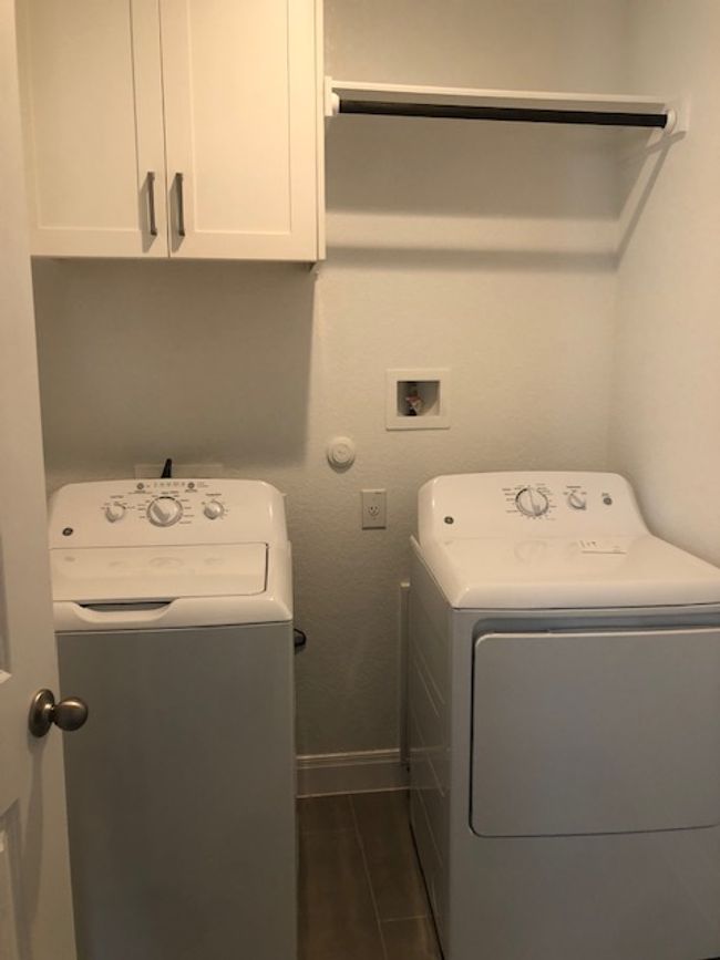 Laundry area with cabinet space and washer hookup | Image 19