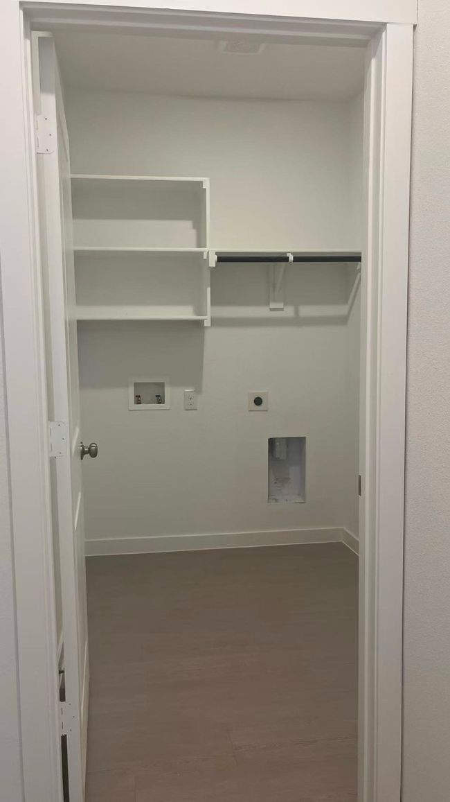 Laundry room featuring washer hookup, dark wood-style floors, and electric dryer hookup | Image 13