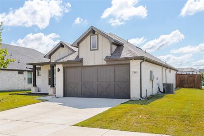 View of front of property with a front entry garage and front yard | Image 3