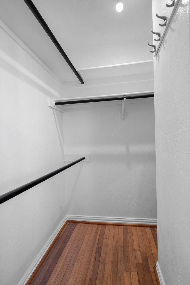 Spacious closet with hardwood / wood-style floors | Image 20