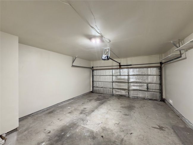 Garage featuring a garage door opener | Image 36