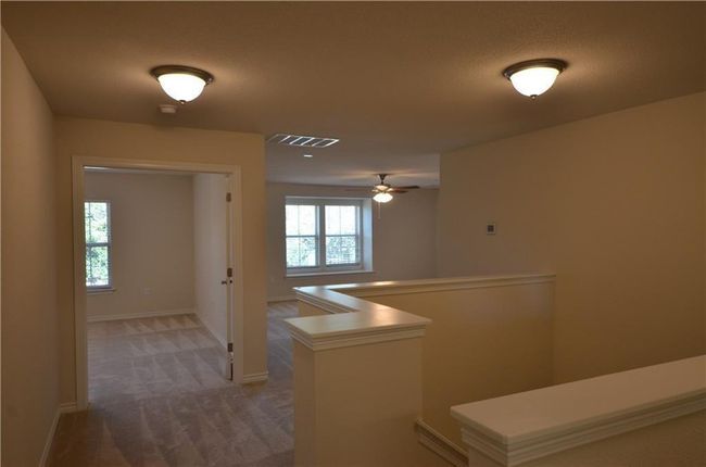 Corridor featuring an upstairs landing and carpet | Image 15