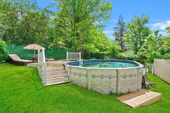 View of swimming pool featuring a deck | Image 30