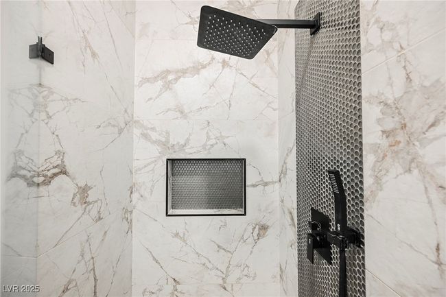 Bathroom details featuring a marble finish shower | Image 34