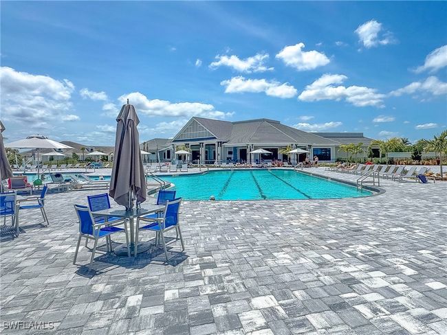 Community pool with a patio area | Image 45