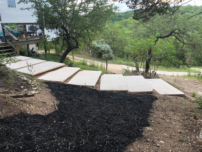 28 limestone 7' slabs placed around the home landscape and under balcony. | Image 33