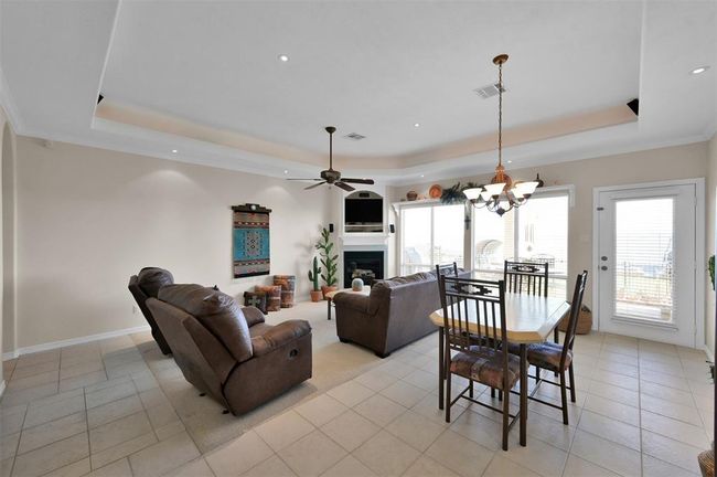 Tray ceilings feature inset lighting and multi-speaker surround sound system. | Image 7