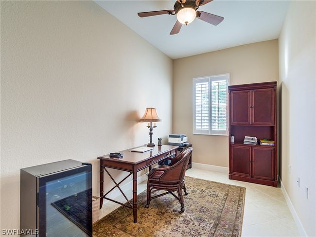 Tiled office featuring ceiling fan | Image 30