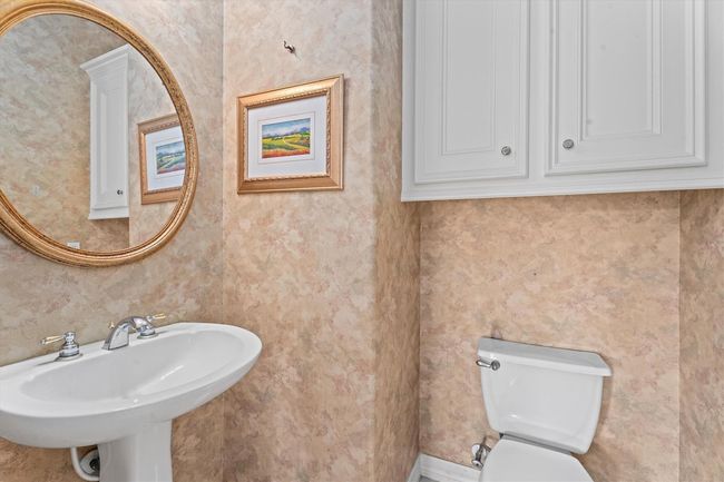 Poweder room located on first level for your guests! | Image 18