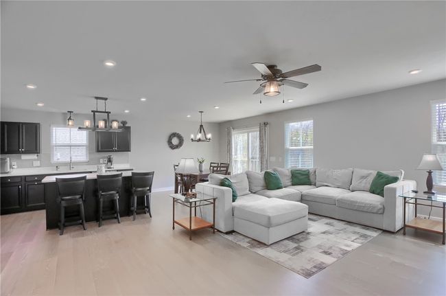 Tons of natural light illuminates the open kitchen/family room area. | Image 23