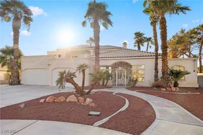 Front of home with circular driveway. | Image 3