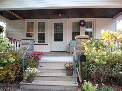 Entrance to property featuring a porch | Image 2