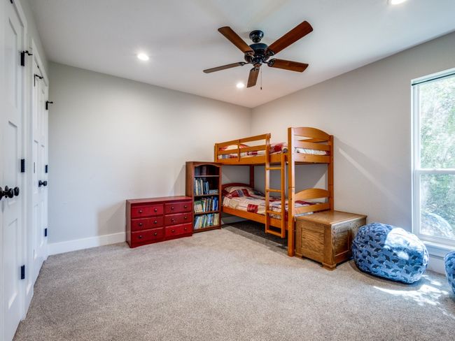 Second of the two, large, guest bedrooms with double reach-in closets, fan recessed lighting and large window. Extra thick carpet pad in this room, too. | Image 22