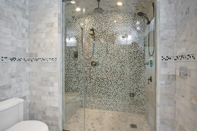 Bathroom with toilet and a stall shower | Image 21